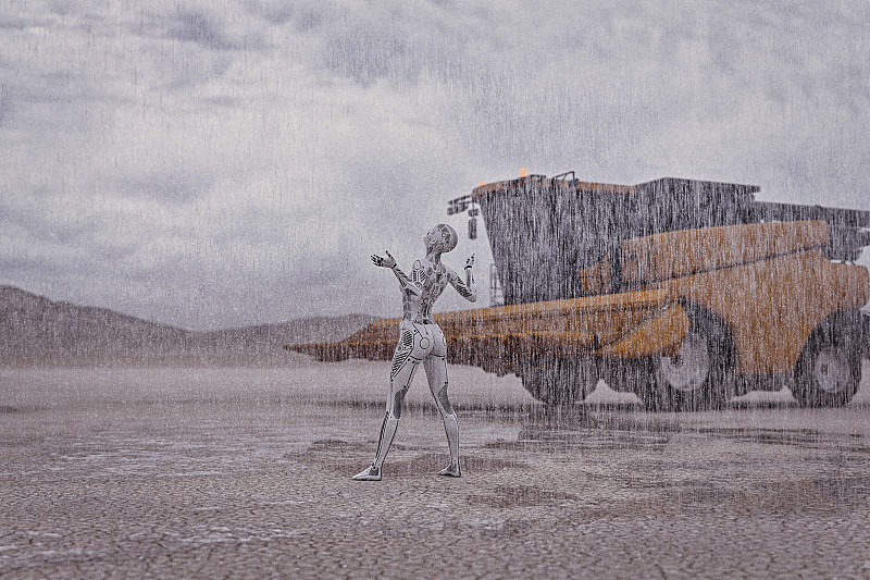 機器人在沙漠中仰望雨水圖片素材