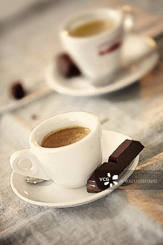 两杯浓缩咖啡配一块黑巧克力图片素材