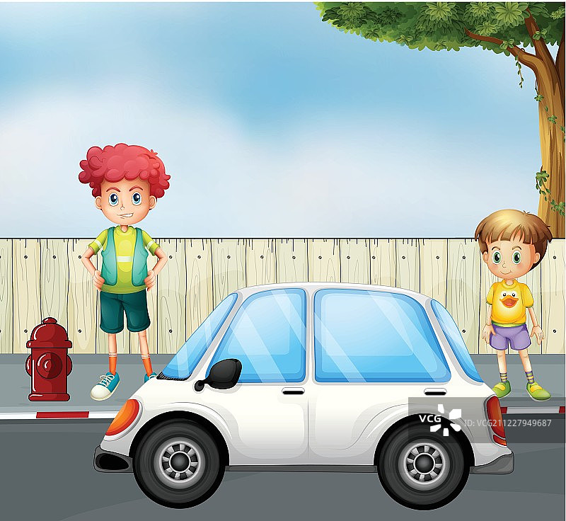 一个男孩和一个小孩在街上开车图片素材