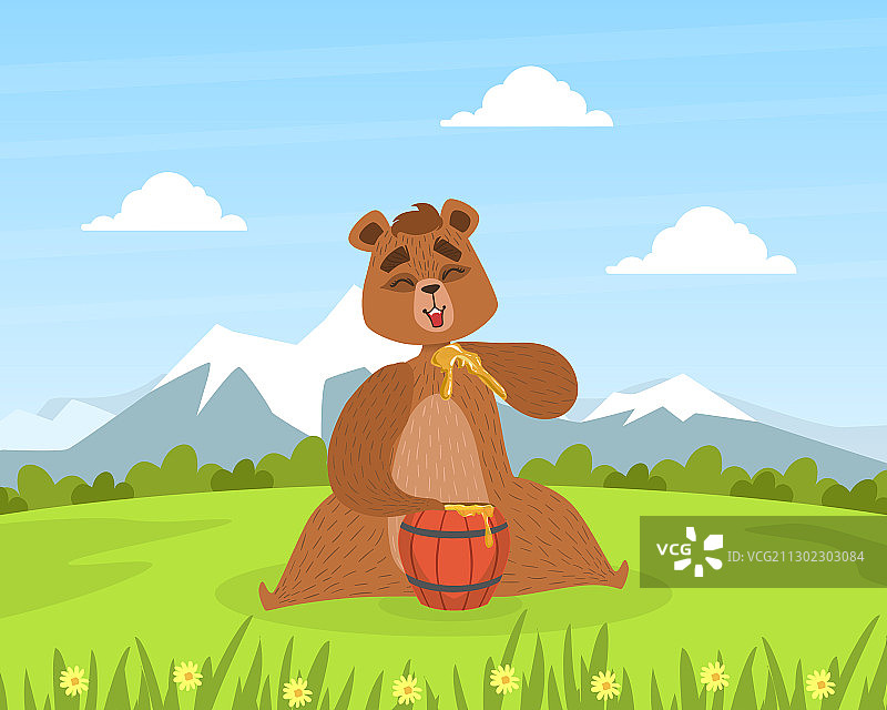 棕熊坐在绿色的草地上吃蜂蜜图片素材