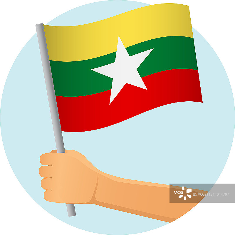 手里拿着缅甸国旗图片素材