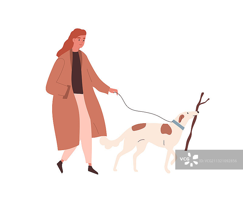 穿着秋大衣的女人牵着宠物散步图片素材