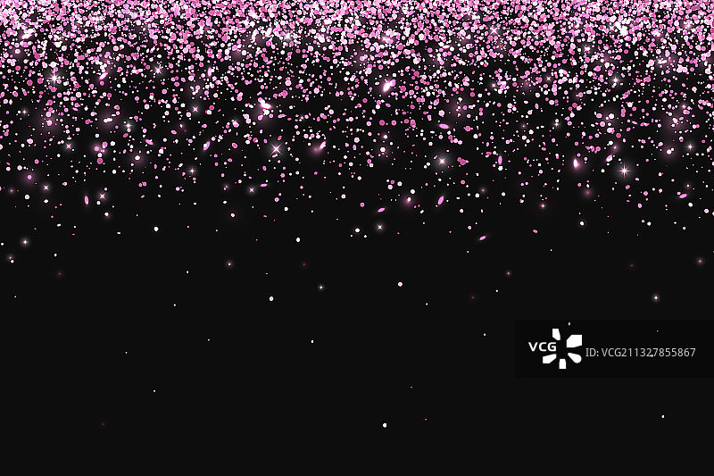 粉红色的粒子落在黑色的背景上图片素材
