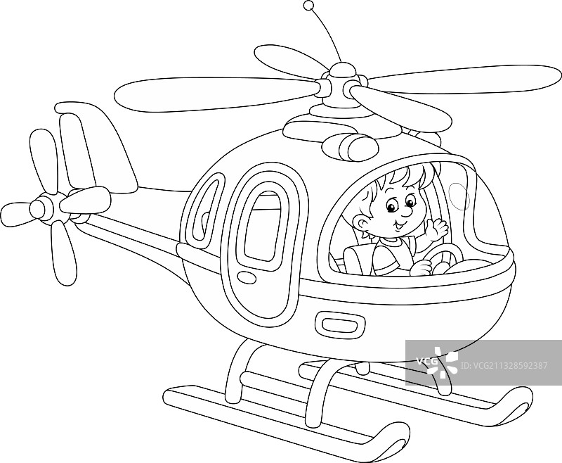 一个小男孩在驾驶一架玩具直升机图片素材