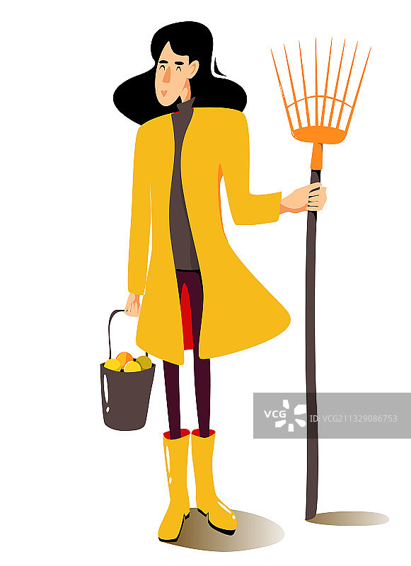 穿着黄色雨衣拿着扇子耙的女人图片素材