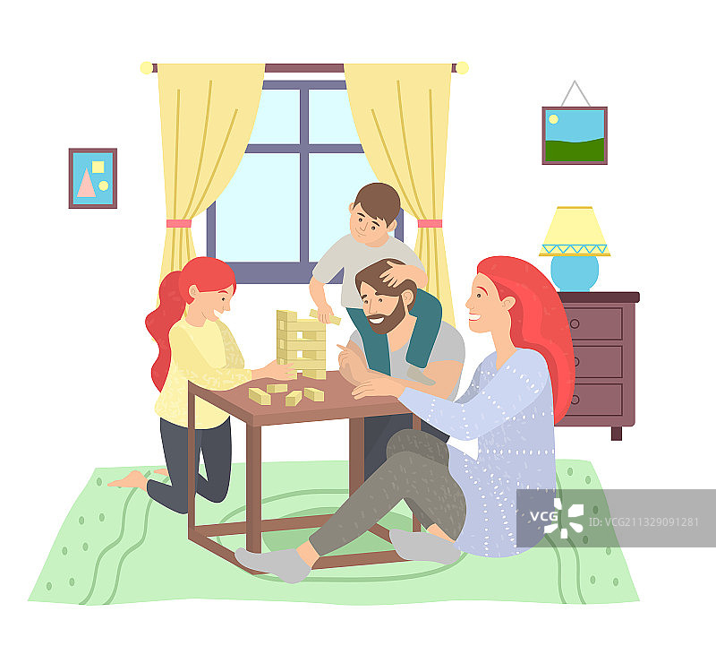 快乐的家庭坐在桌子上玩层层叠图片素材