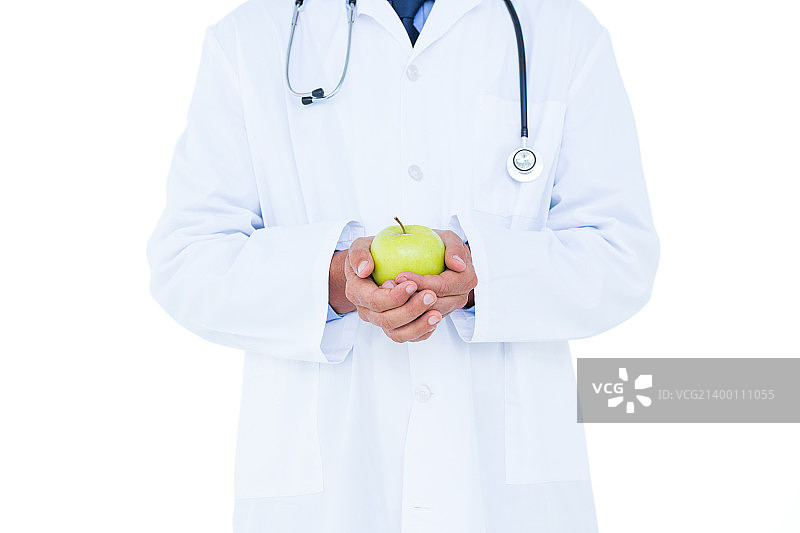 医生拿着绿苹果图片素材