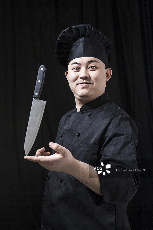 手拿刀的厨师图片素材