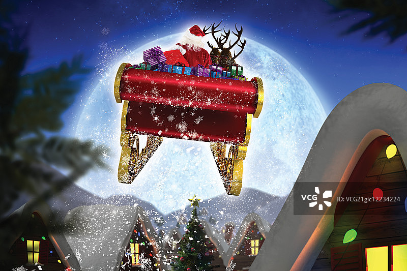 圣诞老人在满月下驾着雪橇向圣诞村庄飞去图片素材