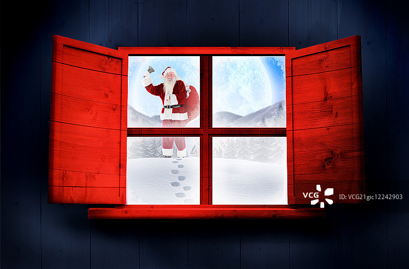 圣诞老人把礼物送到村庄靠窗的木屋里图片素材