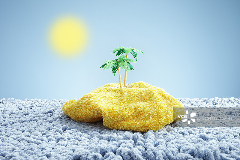 地毯海中的毛巾岛上的玩具棕榈树图片素材