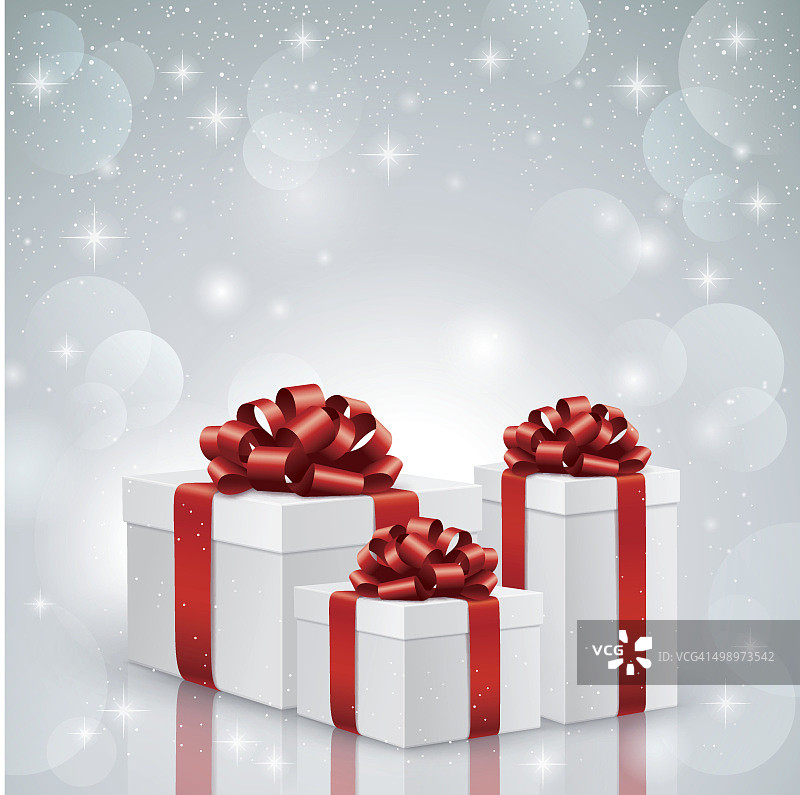圣诞礼物与红色丝带在银色的背景图片素材