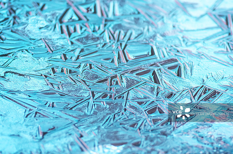 冰冻的蓝色冰的质地，特写图片素材