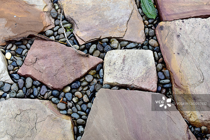 人行道街道的石头表面，抽象的背景图片素材