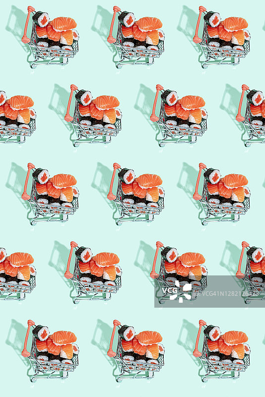 鲜嫩的日本三文鱼寿司手握寿司在彩色背景的购物车中图片素材