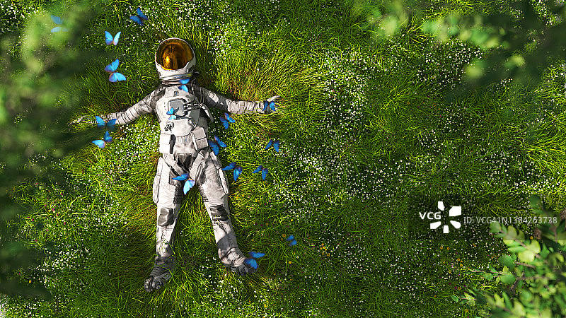 宇航员躺在草地上图片素材