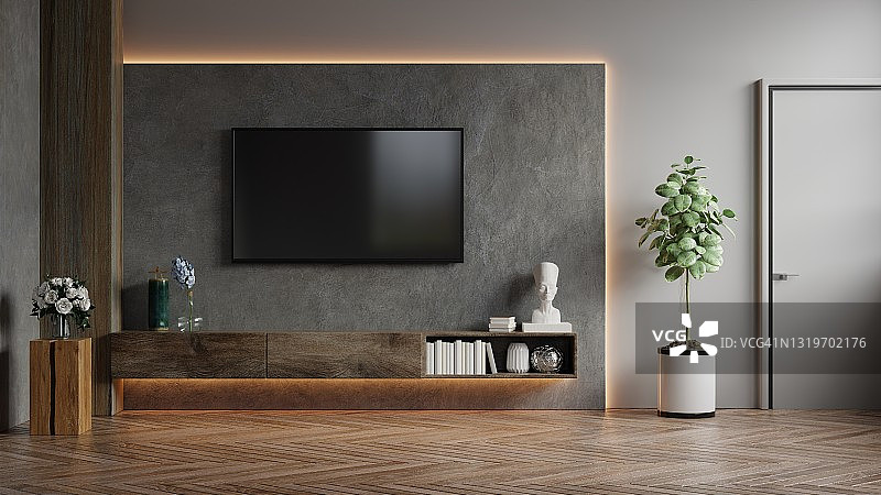 模拟电视墙安装在一个黑暗的房间和混凝土墙。图片素材