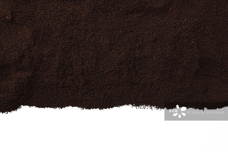孤立的镜头，研磨的咖啡豆边界上的白色背景。图片素材
