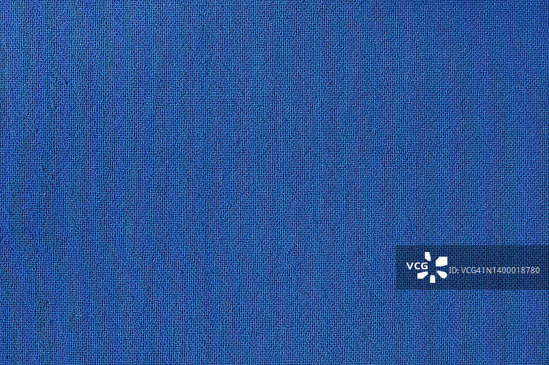 深蓝纯棉面料面料质感为背景，天然纺织图案。图片素材