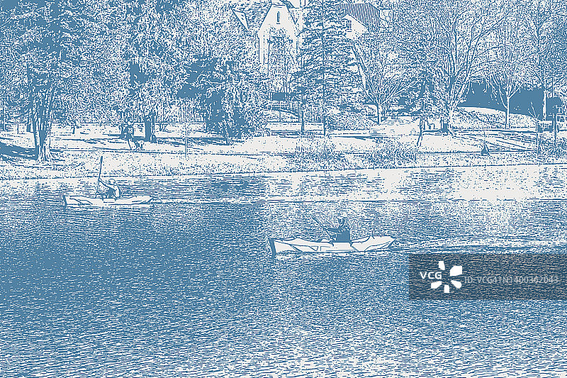 公园湖上的皮划艇爱好者图片素材