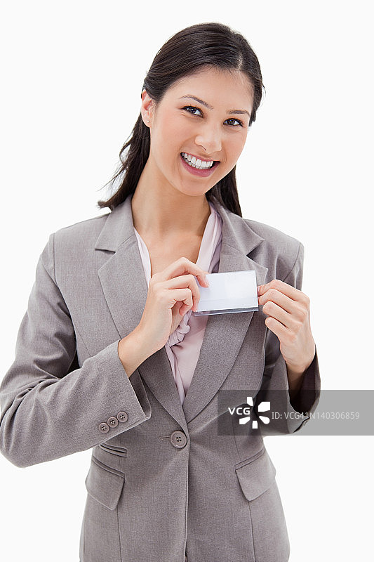 微笑的女商人戴着姓名徽章图片素材