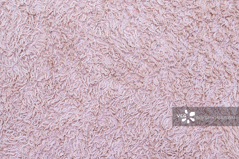粉红色柔软的地毯纹理和背景的全帧拍摄。图片素材