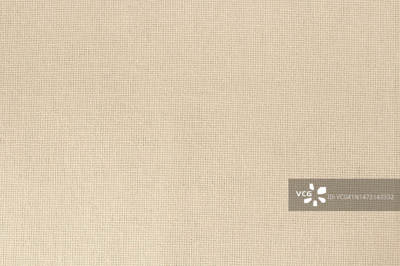 棕褐色棉织物为布纹背景，天然纺织图案。图片素材