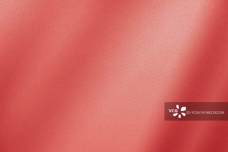 浅红色橙红色桃丝缎面料。梯度。珊瑚粉色。优雅奢华的抽象背景。行。布料。窗帘。图片素材