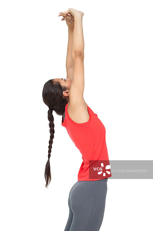 一个运动的年轻女子伸出手的侧面视图图片素材