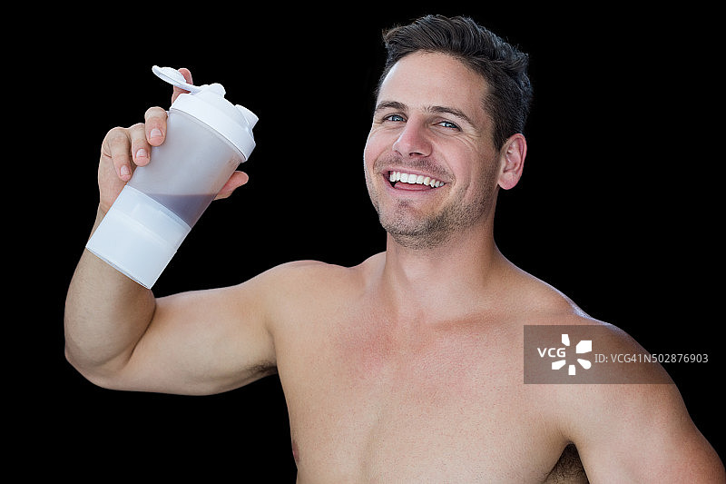 快乐的肌肉男持有蛋白质饮料图片素材