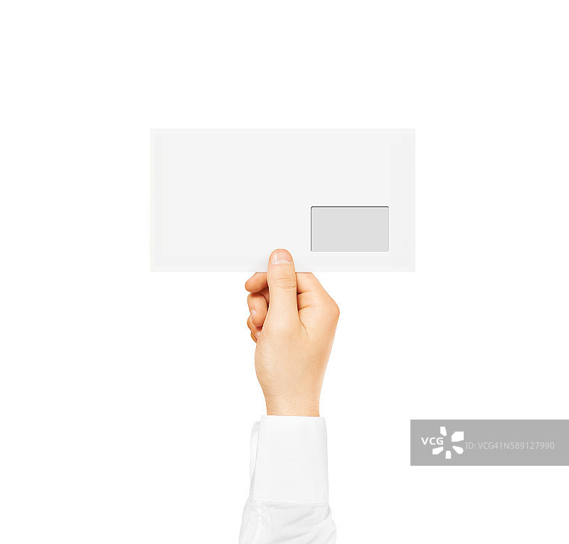 白色空白信封模拟在手里。空的职位图片素材