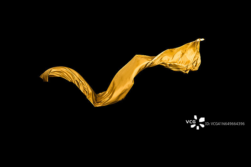 金色柔软的缎子在风中飞舞的背景图片素材