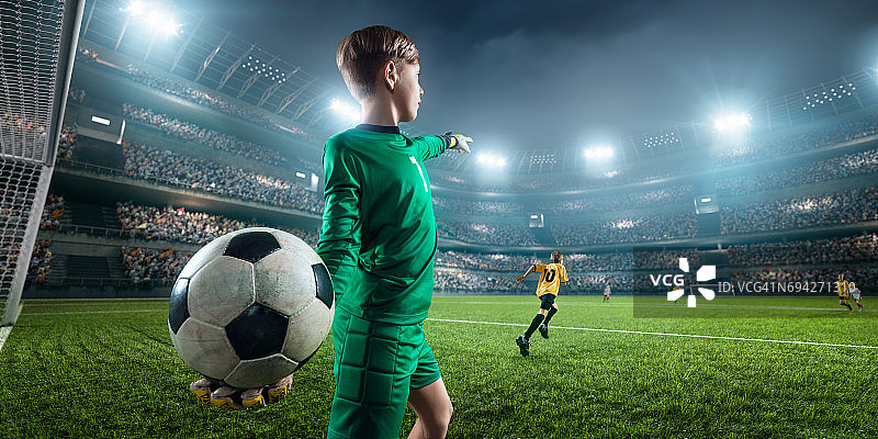 足球儿童守门员在行动在3D戏剧体育场图片素材