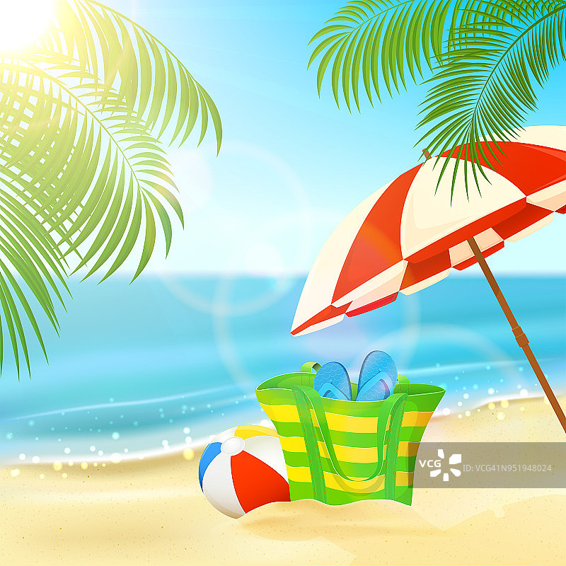 夏日热带海滩上的包和伞图片素材