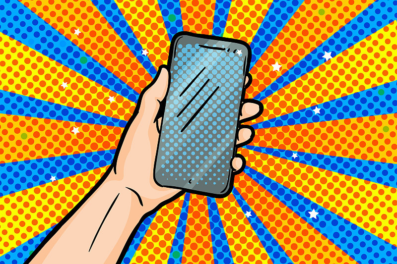 手持智能手机在波普艺术风格在黄蓝色背景。图片下载