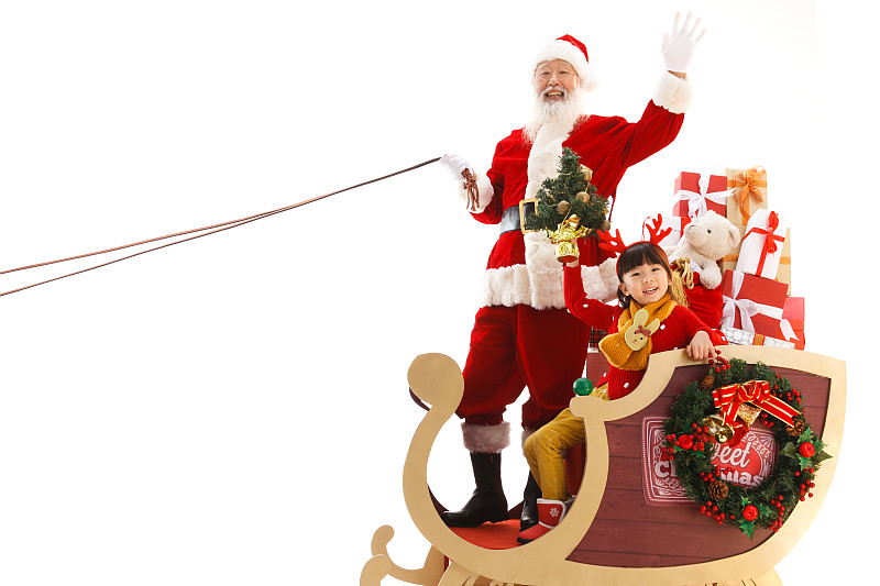 圣诞老人和小女孩坐在雪橇上图片下载