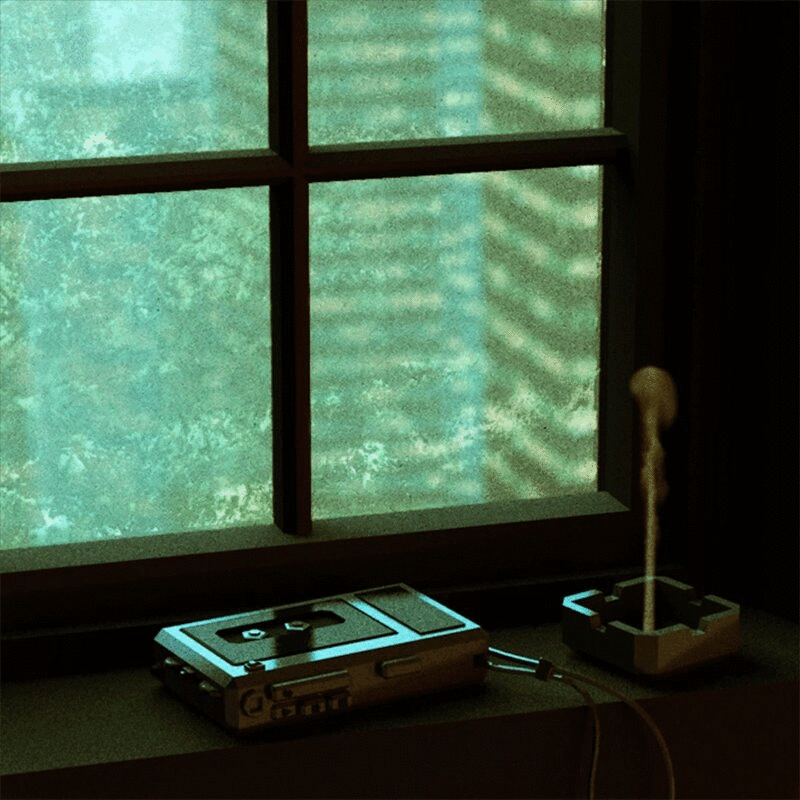烟灰缸旁边窗台上的磁带录音机的动画图片下载