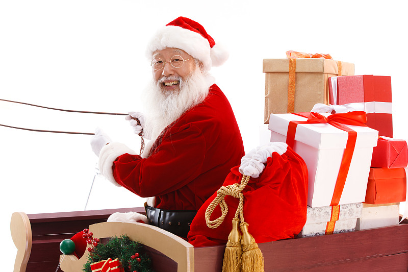 圣诞老人驾着雪橇派送礼物图片素材