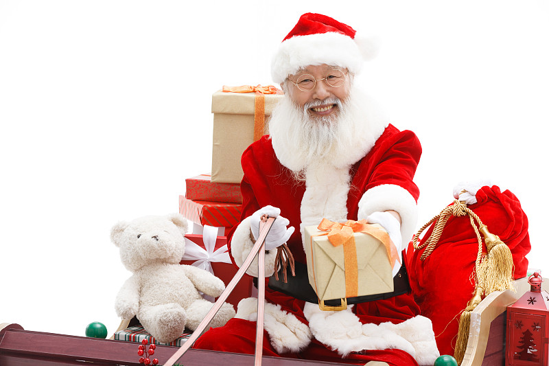 圣诞老人驾着雪橇派送礼物图片下载