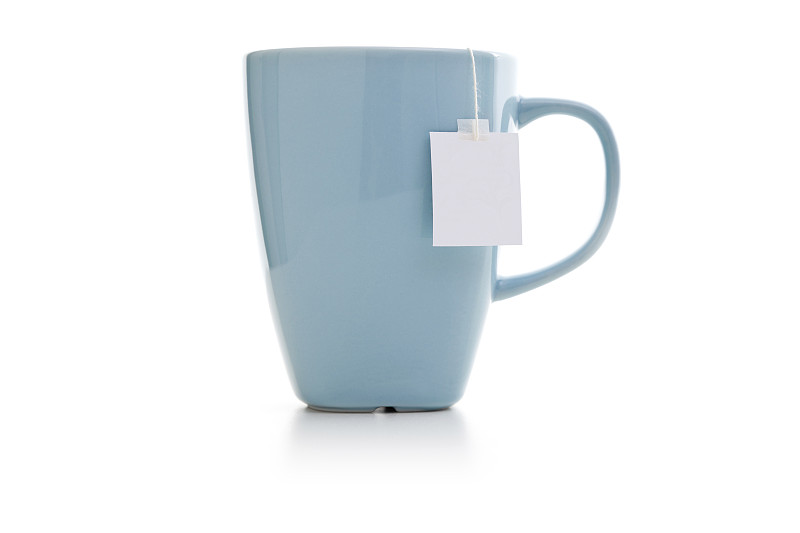 蓝色的茶杯和茶包图片下载