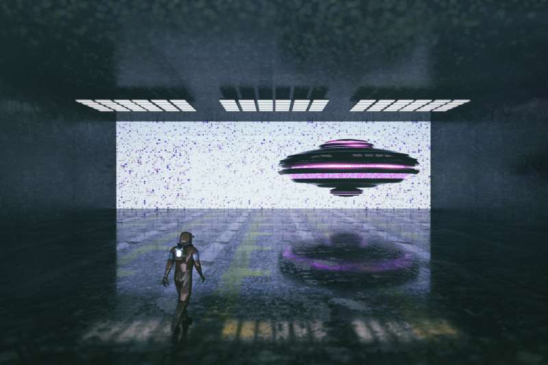 Astronaut walking towards UFO in hangar bay图片下载