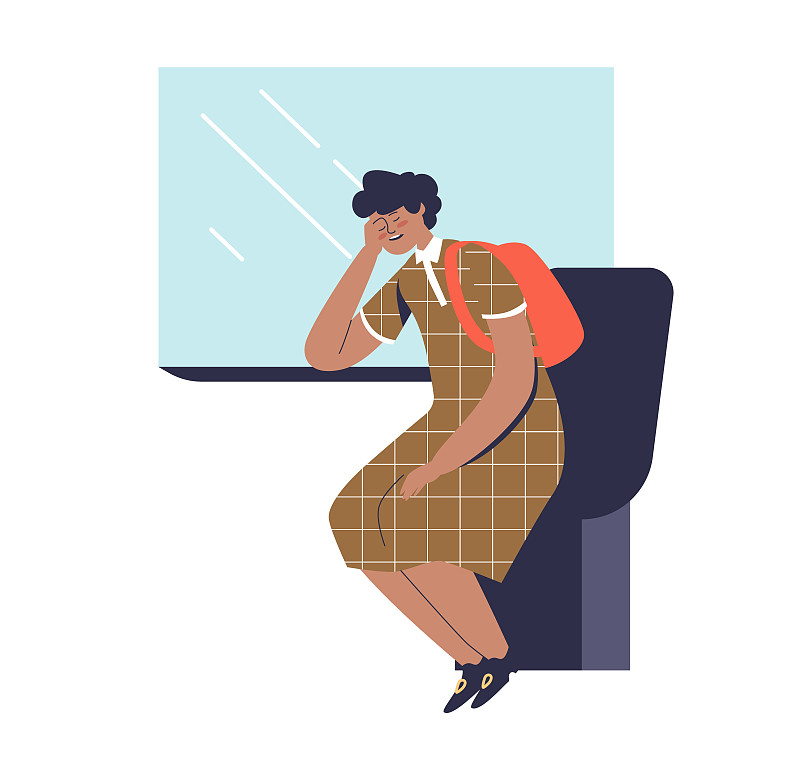 乘火车时，一位妇女坐在靠窗的座位上睡觉。累了女乘客图片素材