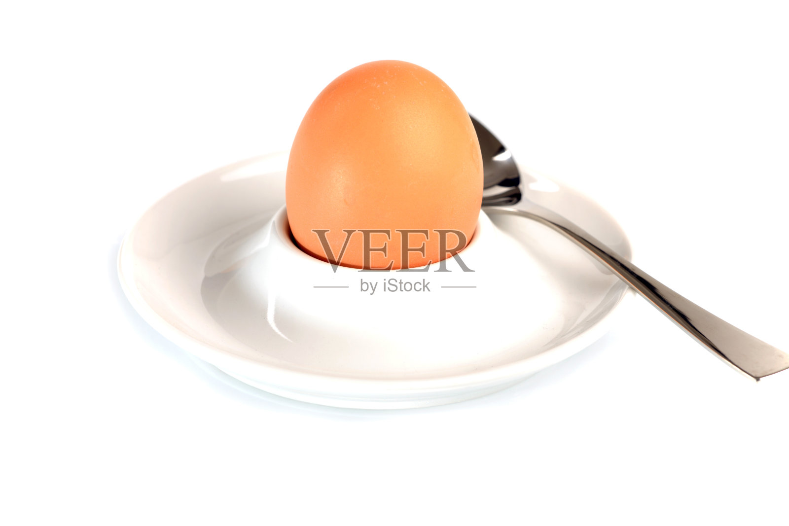 鸡蛋杯里的棕色鸡蛋照片摄影图片
