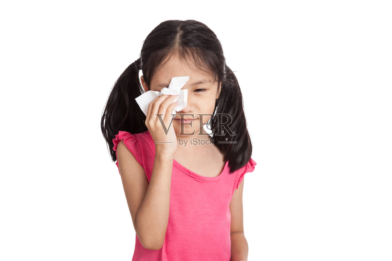 亚洲小女孩用餐巾纸哭照片摄影图片