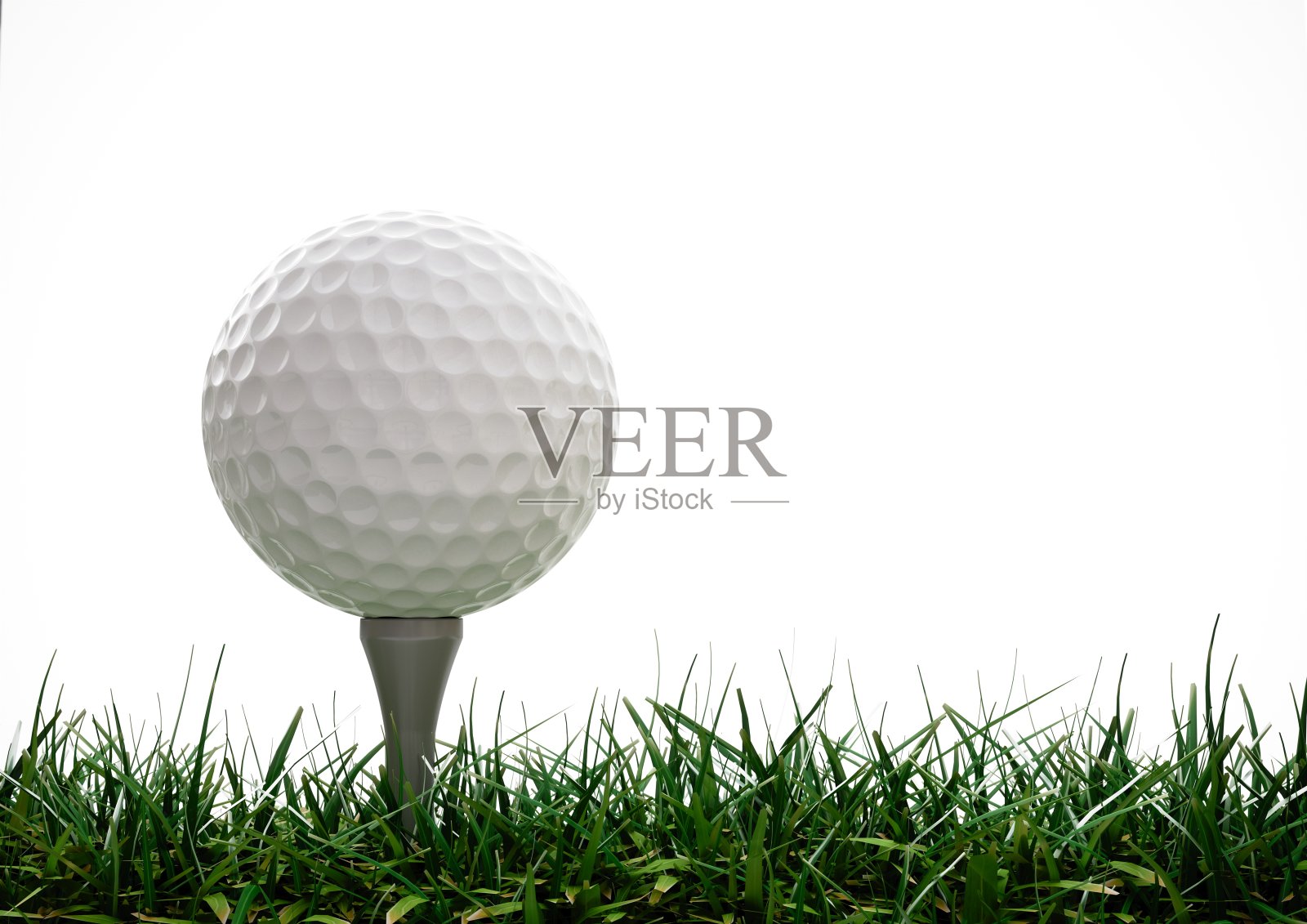 高尔夫球，球座在草地上照片摄影图片