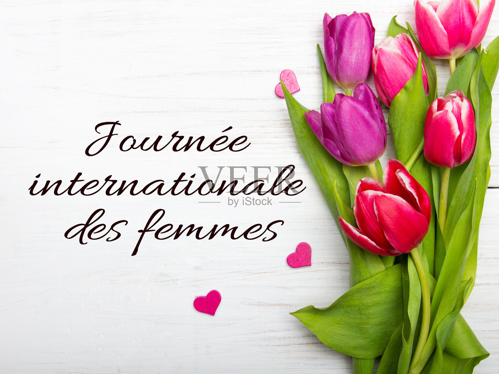 妇女节卡片上有法语单词“国际妇女节”。照片摄影图片