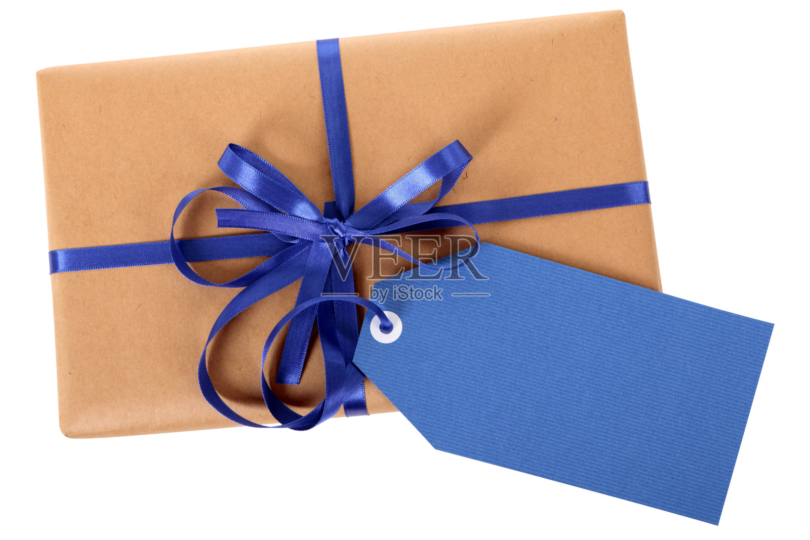 棕色纸包，上面有蓝色的礼品标签照片摄影图片