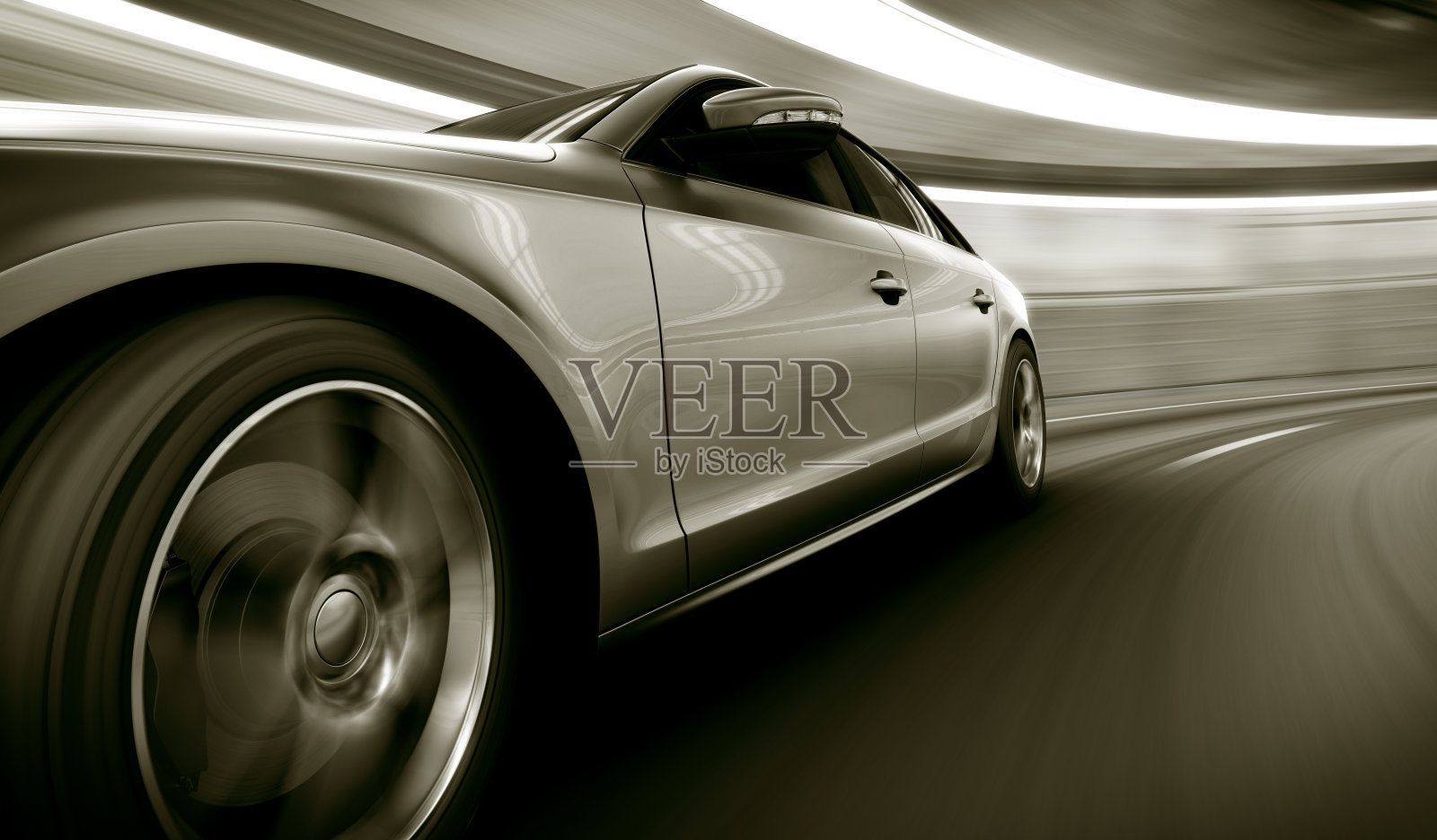 一辆银色的车在隧道里超速行驶照片摄影图片