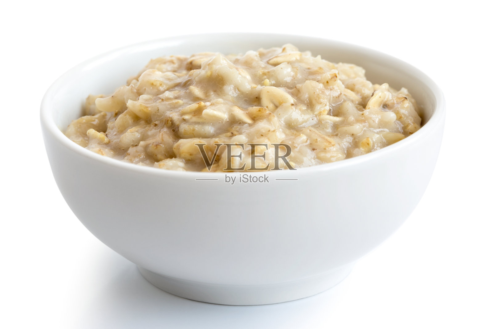 煮熟的麦片粥在白色陶瓷碗上孤立白色。照片摄影图片