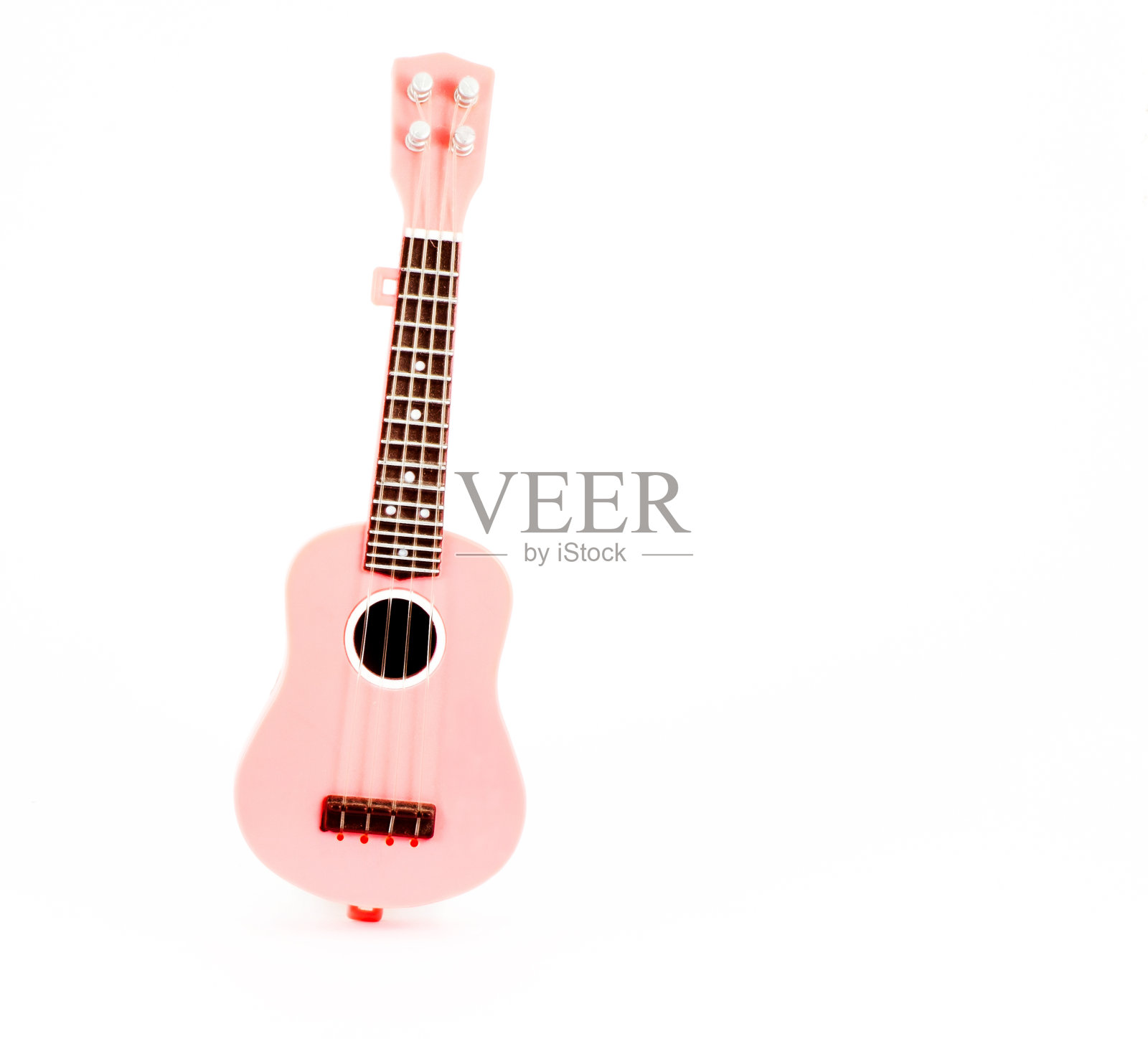 粉色吉他玩具孤立在白色背景照片摄影图片